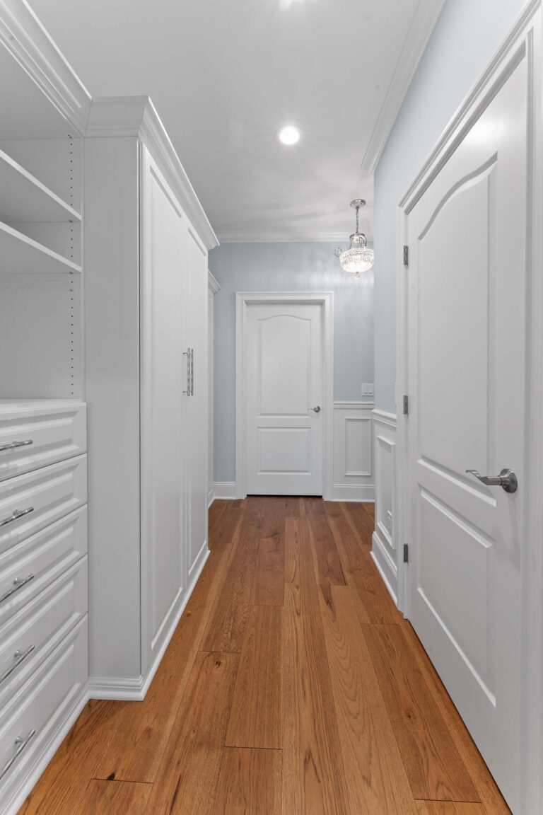 Narrow hallways in Bucks County, PA with light blue walls and white doors.